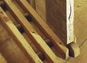 Grooves in the floor with wheels for easier movement of flats and with a wheel chock in front of a flat. 