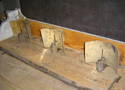 Argand lamps in their original location on a footlight.