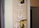 Argand lamps in their original location on hooks on the side of the proscenium arch. 
